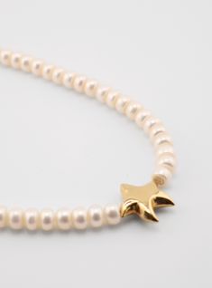 Handcrafted Starfish Pearls Necklace, embodying elegance and artistry. Drape yourself in this luxurious accessory, adorned with lustrous pearls and a delicate starfish pendant. Every piece is unique They are made by hand in Florida. Available in 16" and 18". Both sizes feature a 2" extension chain.” long Starfish-shaped Necklace With Pearl Charm For Gift, Star-shaped Pearl Drop Jewelry For Gifts, Star-shaped Jewelry With Pearl Charm Gift, Star-shaped Jewelry With Pearl Charm As A Gift, Star-shaped Pearl Drop Jewelry As Gift, Elegant Starfish Charm Star Necklace, Elegant Starfish Charm Necklace, Star-shaped Pearl Charm Jewelry, Elegant Star-shaped Necklace With Starfish Charm