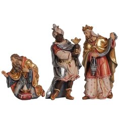 three figurines of men dressed in medieval clothing