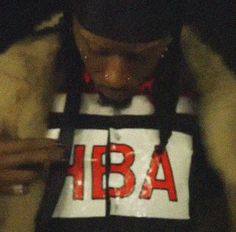 a person wearing a hoodie with the letters hba on it