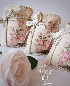 three small bags with flowers on them and the words dekor by me written in white