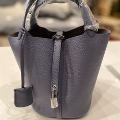 Color: Grey-Blue Approximate: Please See The Pictures Brand New Without Tag Leather: Cowhide Silver-tone Hardware Pouch Bag For Shopping, Blue Textured Leather Evening Bag, Silver-tone Hardware Pouch Bag For Daily Use, Daily Use Pouch Bag With Silver-tone Hardware, Daily Use Bucket Satchel With Silver-tone Hardware, Silver-tone Hardware Bucket Shoulder Bag For Shopping, Silver-tone Hardware Bucket Satchel For Daily Use, Chic Daily Use Bucket Bag With Silver-tone Hardware, Chic Bucket Bag With Silver-tone Hardware For Daily Use