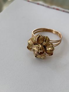 Showstopper 18k gold ring circa 1960's is in perfect condition. Size 7 1/2can be size. Handmade Jewelry has a uniqueness to bring the best from  creativity and Passion check ou more info @ninariojewelry In/teresa-pecego-586752190 Each piece has been identified and carefully graded by Maria Pecego who is certified by Gemological Institute of America,(GIA), AJP, GP, GD - Gemologist Certified from Mineralogy and Technology Center (CETEM), and De Beers Diamond Foundation Certificate. Antique 14k Gold Flower Ring, Vintage 14k Gold Flower Ring For Formal Occasions, Antique Style 14k Gold Flower Ring, Vintage 14k Rose Gold Flower Ring, Vintage Rose Gold 14k Gold Flower Ring, Vintage Yellow Gold Recycled Gold Ring, Vintage 14k Gold Flower Ring For Gift, Vintage 14k Gold Flower Ring For Anniversary, Antique Gold Flower Ring For Formal Occasions