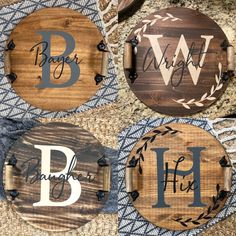 three wooden signs with the letters b, w, and h on them