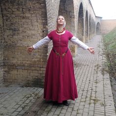 Made on the most common patterns of the Burgundian medieval gowns. It is a good choice for a Medieval festivals and dance events on the period. I both can be a peasant costume or town gown. The kirtle is made of wool and the bodice is strengthen by contrast linen lining. It is fitted due to the front lacing. The cord is hand made and there is an option to chose a rings or hand sewn holes for lacing. Note, the chemise is not included in the listing. The custom copy and different materials is avai Tudor Kirtle Pattern, Victorian Dress With Historical Design For Medieval Festivals, Fitted Peasant Medieval Dress With Long Sleeves, Medieval Dress For Larp And Medieval Festivals, Medieval Long Sleeve Prairie Dress, Peasant Style Medieval Dress With Long Sleeves, Fitted Prairie Dress For Larp And Medieval Festivals, Medieval Style Prairie Dress For Medieval Festivals, Medieval Victorian Dress With Long Sleeves