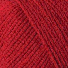 red yarn ball on white background