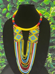 This thick necklace is made of fine multilayer beads wound together. It is very comfortable to wear and stays put around the neck. The beads are very bright and beautiful.  Contact owner for any personalization. Thanks for vising my shop and come again. Stay safe https://www.etsy.com/shop/naistumityujewelry Handmade Yellow Double Strand Necklace, Handmade Double Strand Yellow Necklace, Yellow Double Strand Beaded Necklace, Yellow Multi-strand Necklace For Gift, Double Strand Polished Bead Necklaces, Double Strand Polished Beads Necklace, Adjustable Yellow Necklace With Dangling Beads, Bohemian Multicolor Layered Necklace With Round Beads, Unique Multicolor Double Strand Necklace