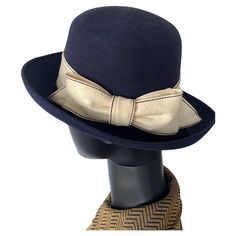 Beautiful 1970s Navy Felt Vintage Beautiful 1970s Vintage Hat. Blue felt with feature white vinyl ribbon and bow. Interior finished with petersham ribbon. In great vintage condition. Measurements are Circumference 54cm / 21inches Crown height 12cm /5inches Brim 9cm / 3.5 inches Vintage Hats, Vintage Hat, White Vinyl, Hats Vintage, Black Color, Accessories Hats, 1970s, Fashion Accessories, Felt