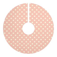 a pink and white polka dot print disc