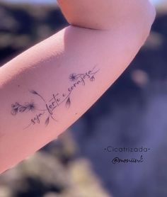 a woman's arm with writing on it