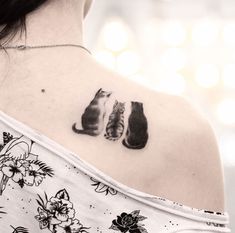 a woman with a cat tattoo on her shoulder