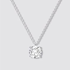 This Stunning Necklace Is A True Piece Of Fine Jewelry. Crafted From 14k White Gold, It Features A Beautiful Round Pendant With One Solitary Diamond. The Pendant Hangs From An 18-Inch Necklace Chain, Making It The Perfect Statement Piece For Any Occasion. The Necklace Is Made With Natural Gemstones And Boasts A Solitaire Setting Style. Its Total Carat Weight Is 1ct, And The Diamond Color Grade Ranges From E-H. Everyday Luxury Diamond White Solitaire Necklace In Sterling Silver, Everyday Luxury Solitaire Necklace In Diamond White, Everyday Luxury Solitaire Necklace In Sterling Silver, Everyday Luxury Sterling Silver Solitaire Necklace, Everyday Luxury White Gold Solitaire Necklace, Timeless Sterling Silver Solitaire Necklace For Formal Occasions, Timeless Formal Sterling Silver Solitaire Necklace, Classic Vvs Clarity Diamond Necklace, Sterling Silver Necklace With Brilliant Cut For Everyday Luxury