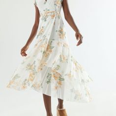 Product Sku: 59391995; Color Code: Light And Airy Midi Dress From Uo In A Classic Wrap Silhouette With A Tie At The Waist. Slim Fit Topped With A Surplice Neckline And Short Flutter Sleeves. Complete With An Allover Floral Print And Tiered Ruffle Hem. Content + Care - 95% Polyester, 5% Spandex - Machine Wash - Imported Size + Fit - Item Shown Is Size Small - Measurements Taken From Size Small - Chest: 17.5” Never Worn Summer Midi Dress With Surplice Neckline For Daywear, White Maxi Dress With Floral Print And Surplice Neckline, Fitted Breezy Midi Dress With Floral Print, White Floral Maxi Dress With Surplice Neckline, White Casual Midi Dress With Surplice Neckline, Casual White Midi Dress With Surplice Neckline, Urban Outfitters V-neck Sundress For Summer, Fitted Breezy Maxi Dress With V-neck, White Casual Dress With Surplice Neckline