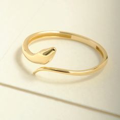 "Here's the Stylish Snake Stacking Ring by Christo! Our 14K Solid Gold Spiral Open Ring is perfect Stackable and Daily Spiral Open Ring for Girls. This Minimalist Index Finger Cuff Ring is designed as Premium Chick Index Finger Ring and 18K Knuckle Ring for her. This Dainty Stacked Ring is perfect Daily wear Ring as a Everyday Simple Ring design for women.  Our Stackable Wrapped Knuckle Band is perfect Motherly Gift Jewelry for mother, wife and mom. This Stylish Minimalist Cuff Ring is also grea Minimalist 14k Gold Open Ring Bracelets, Stackable Open Ring Bracelets As Gift, Yellow Gold Open Ring Bracelets As Gift, Yellow Gold Open Ring Bracelet For Gift, Yellow Gold Open Ring Bracelet As Gift, Minimalist Bangle Rings For Gifts, Adjustable Minimalist Snake Ring, Minimalist Adjustable Open Snake Ring, Adjustable Stackable Open Ring Bracelets