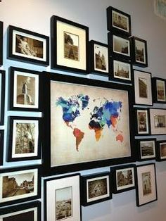 a group of framed pictures hanging on the wall