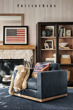 a living room filled with furniture and a fire place in front of a book shelf