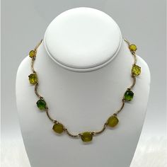 For Your Consideration Is A Vintage Trifari Necklace With Tags Still Attached! The Necklace Features Various Shades Of Green Glass On A Gold Tone Curved Bar Chain. There Are Also Links With Small Clear Crystals. The Necklace Measures 16 Inches With Lobster Clasp And 1 Inch Extender. Very Pretty! Green Glass Necklace For Party, Elegant Green Glass Necklaces, Adjustable Green Metal Necklaces, Green Glass Jewelry With Adjustable Chain, Adjustable Glass Necklaces For Formal Occasions, Curved Bar, Trifari Jewelry, Vintage Trifari, Clear Crystals