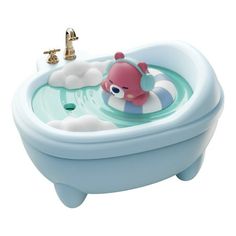 a blue bath tub with a pink fish in it