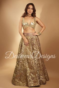 Made to Order/Measurement/Custom Order Lehenga - Color :  Gold - Fabric : crush tissue - Fully flared paneled lehenga - Embroidered  Blouse -  Net Dupatta with Gold Border - Drawstring closure with Tassels - - It can be customize in any design or size  PLEASE NOTE: BUYERS ARE RESPONSIBLE FOR ANY CUSTOMS AND IMPORT TAXES THAT MAY APPLY. This is a made to order product. If you opt for 'Made To Measurement Option', we will provide a measurement template and you can share the measurements likewise. If you want to opt for 'Standard Size', Please refer to the size chart provided in the listing. Shipping: Standard Shipping is done by DHL ecommerce and it mostly takes 2 to 3 weeks to deliver after dispatch. Express Shipping is done by DHL express and it mostly delivers within a week after dispatch Crush Tissue Lehenga, Gold Brocade Pre-draped Saree With Zari Work, Party Pre-draped Saree With Mirror Work In Art Silk, Pre-draped Saree With Dupatta For Navratri Party, Semi-stitched Party Sets For Diwali, Pre-draped Tissue Silk Saree With Dupatta For Party, Fitted Pre-draped Saree With Sequins For Diwali, Party Floor-length Art Silk Pre-draped Saree, Semi-stitched Saree For Wedding And Party Season