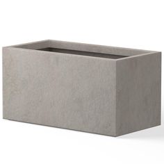 a concrete planter sitting on top of a white surface