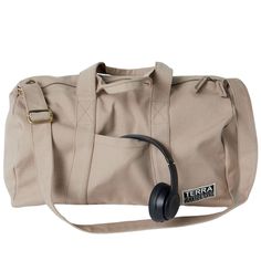 a beige duffel bag with headphones attached to it