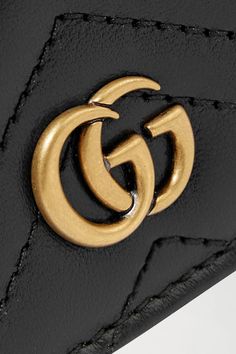 Black GG Marmont quilted leather wallet | GUCCI | NET-A-PORTER Gucci Classic Wallets With Logo, Luxury Wallets With Engraved Logo, Classic Gucci Wallets With Logo, Luxury Wallets With Engraved Logo For Everyday Use, Gold Leather Wallet With Logo Plaque, Gucci Designer Wallets With Logo, Designer Gucci Wallets With Gold-tone Hardware, Luxury Gold Wallets With Logo Plaque, Luxury Wallet With Logo Plaque