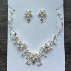 Beautiful Floral Motiff Earring And Necklace Set Perfect For A Wedding Day Or Special Event. Never Been Worn, New With Tags. White Crystal Bridal Necklace With Matching Earrings, Delicate White Jewelry Sets For Anniversary, White Necklace With Matching Earrings For Wedding, White Necklaces With Matching Earrings For Wedding, White Dangle Bridal Necklace For Anniversary, White Bridal Necklace With Matching Earrings For Anniversary, White Bridal Necklace With Matching Earrings, Bridal Hair Barrettes, Gold Crystal Necklace