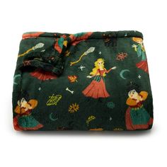 a green blanket with cartoon characters on it