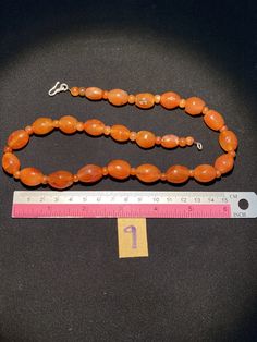 The beautiful orange color carnelian beads necklace from Himalaya Nepal This beads were used in prayer malas and used as jewelry and amulets in ancient times very smooth and shinny surface of this beads because of passage of time and usage of this beads in prayers mala and in necklace The age of this beads are more than 1000 years small size agate beads are used as spacers in the necklace we provide fast and free shipping service to our customers by which can get the items by maximum 7 working d Traditional Orange Jewelry For Healing, Traditional Orange Healing Jewelry, Traditional Orange Gemstone Bead Necklaces, Traditional Orange Gemstone Beads Necklace, Orange Carnelian Necklace In Spiritual Style, Traditional Orange Beaded Necklace With Gemstones, Traditional Orange Gemstone Beaded Necklace, Traditional Orange Beads With Natural Stones, Orange Agate Oval Beads Jewelry