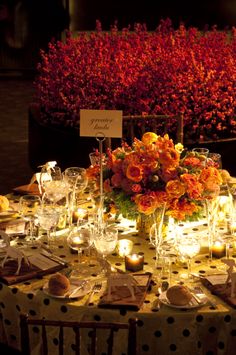 the table is set with candles and flowers