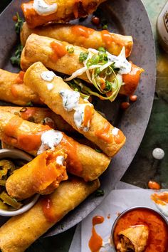 some food is sitting on a plate with sauces and condiments around it