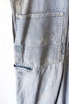 Vintage Big Smith Striped Repaired Overalls. Good condition with patches and repairs that lend to the overall style of the overalls. Light-wash railroad stripe overalls with straight leg and pockets. No marked content, feels like cotton, machine wash cold. No marked size, fits M/L best. Approx. Measurements: Waist: 19 1/2" Inseam: 28 1/2" Washed Blue Cotton Utility Denim Jumpsuit, Cotton Overalls With Patch Pockets And Bib Front, Utility Cotton Overalls With Patch Pockets, Indigo Cotton Overalls With Pockets, Utility Cotton Overalls With Straight Leg, Utility Style Cotton Overalls With Straight Leg, Cotton Utility Overalls With Straight Leg, Vintage Washed Cotton Overalls, Washed Blue Cotton Straight Leg Overalls