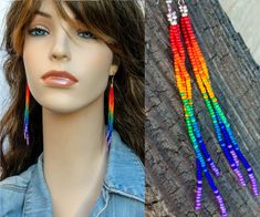 a mannequin head wearing multicolored beaded earrings