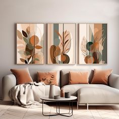 a living room with three paintings on the wall