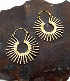 HANDMADE Sunshine hoops. Stunning boho beautiful sun earrings sunburst ethic celestial jewelry  Ideal for everyday wear or for a special bohemian look. SIZE Aprox Length: 5.6 cm Aprox diameter: 4.5 cm Handmade with high quality hypoallergenic Jewelery brass, nickel free. LINK Please follow the link to view my shop for other beautiful pieces. https://www.etsy.com/uk/shop/JagathaStudio Sun Earrings, Celestial Earrings, Boho Beautiful, Boho Hippie Chic, Chic Gifts, Earrings Bohemian, Bohemian Look, Celestial Jewelry, Bohemian Hippie