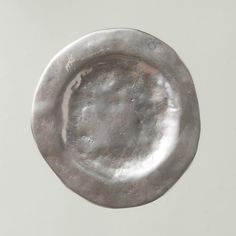 an old silver plate on a white background