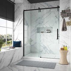 a bathroom with marble walls and flooring