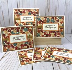 four cards with the words happy thanksgiving written on them, all in different colors and designs