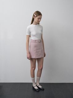 This product, the Janie Belted Skirt, is designed to offer a sleek and stylish addition to any fashion-forward wardrobe. The skirt's A-line cut is flattering on a variety of body types, and the included belt cinches at the waist for an added touch of elegance. With its clean lines and minimalist design, this skirt is a versatile piece that can be dressed up or down. - The Janie Belted Skirt features an A-line cut that gracefully complements the figure.- It comes with a matching belt that highlights the waist and adds a sophisticated detail.- The skirt is secured with a discreet back zipper, allowing for a seamless and comfortable fit.- Constructed with a smooth, lightweight fabric, it provides a comfortable wear suitable for different seasons. Chic Belted Short Skort, Chic Skirt With Belt Detail, Mini Length, Elegant Belted Skort, Chic Short Belted Skirt, Workwear Skirt With Belt, Chic Mini Skirt Bottoms With Belt, Chic High Waist Mini Skirt With Belt, Belted Short Skirt For Work, Chic Mini Skort With Belt