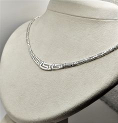 Buy a unique Handmade Ancient Greek Key Meander Silver Necklace For Women | Discover a large collection of Ancient Greek Jewelry in our ON-LINE shop | FREE SHIPPING all over the world This product is a beautiful silver 925 Necklace inspired by the Ancient Greek Key pattern-Meander.A meander or meandros (Greek: Μαίανδρος) is a decorative border constructed from a continuous line, shaped into a repeated motif. Such a design is also called the Greek fret or Greek key design. Visit my Home Page: https://www.etsy.com/shop/GreekHistoryArt Type We offer 1 type of necklace  Size Length:Adjustable Width:0.8cm(0.32 inches) IF YOU WANT OTHER SIZE PLEASE CONTACT US Material All my products are pure Sterling Silver. This necklace is Shiny Silver and degrade. If you wish to see more products with Meande Classic Silver Engraved Necklace, Classic Silver Necklace Stamped 925, Classic Handmade Silver Necklaces, Classic White Gold Necklace Stamped 925, Silver Engraved Necklace Fine Jewelry, Fine Jewelry Silver Engraved Necklace, Classic Sterling Silver Necklace Stamped 925, Silver Necklace With Sterling Silver Clasp For Anniversary, Engraved Silver Necklace Fine Jewelry