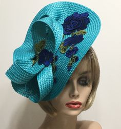 "Turquoise Derby Fascinator, Horse Race Hat, Kentucky Derby Hat, Races Fascinator, Blue Rose Church Hat, Tea Party Hat, Wedding Guest Hat This elegant summer hat is perfect to wear to a Garden Party, Wedding Guest, Showers, Beach Wedding, Graduation, Church or Races. This hat is a Turquoise Fascinator featuring a Dark Blue embroidered accent piece with a matching 1\" Berry satin covered headband. Hats and accessories are not returnable. Please review our shop policies section if you have any questions, thank you. This hat for women ships free First Class Mail within one day. All hats are ready to ship in a perfectly sized box for the hat. Not folded.  When not wearing your hat you can display it on a dresser, bed corner, or anywhere to enjoy it. Each piece is uniquely made one at a time wi Hat Wedding Guest, Wedding Guest Hat, Horse Race Hats, Bed Corner, Wedding Hats For Guests, Hat Tea Party, Dresser Bed, Derby Fascinator, Hat Wedding