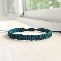 Handwoven W/ Teal Blue Waxed Polyester Thread In A Macrame Square-Knot Pattern. This Bracelet Is Sturdy & Water-Proof, Perfect For Wearing All Day, Everyday & For Layering With Other Bracelets! Finished W/ A Secure Sliding Knot. : Adjustable Knot! (Fits 5 In. To 8.5 In. Wrist) #: Handmade Bracelet Boho Romantic Goth Fairy Grunge Jewelry Gypsy Stackable Bracelet Dainty Minimalist 90s Y2k 2000s Vintage Retro Jewelry Surfer Beach Coconut Girl Granola Girl Jewelry Bracelet Friendship Gift Cutecore K Casual Blue Macrame Bracelets, Casual Blue Macrame Braided Bracelets, Casual Braided Bracelets With Macrame In Nylon Cord, Casual Macrame Braided Bracelets In Nylon Cord, Casual Macrame Braided Bracelet With Nylon Cord, Casual Turquoise Braided Bracelet With Sliding Knot, Casual Green Macrame Bracelets, Casual Green Macrame Jewelry, Casual Green Macrame Bracelet