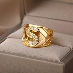 This elegant ring for any occasion features a large blocky signet design with a high-quality stainless steel construction and gold color finish. Its adjustable one-size-fits-all design makes it perfect for both men and women, and the unique A-Z choose your own letter initial allows for personalized representation. Perfect for gifting, this timeless jewelry is sure to make a statement. Harry Styles Rings, Gold Initial Ring, Wedding Initials, Letter Ring, Couple Jewelry, Chunky Rings, Initial Ring, Gold Initial, Platinum Metal