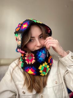 This handmade crochet balaclava with a black base and vibrant granny square patterns is the ultimate winter accessory for those who appreciate bold, boho style. Perfect for keeping warm while making a fashion statement, this balaclava offers a blend of comfort, color, and creativity. *Handmade with care using soft, high-quality yarn *Features classic granny square motifs in vibrant colors *Provides full face coverage, keeping you warm during winter activities *Stylish and functional, perfect for Balaclava Granny Square, Black Balaclava, Granny Square Balaclava, Classic Granny Square, Crochet Balaclava, Bold Boho, Granny Squares Pattern, Square Patterns, Comfort Color