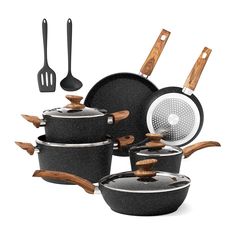 an assortment of pots and pans with spatulas on the bottom one is black