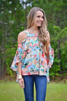 THE PRETTIEST SHIRT!!  It has a breezy cold shoulder fit with fabulous flowing statement sleeves. Fabric is lightweight and breezy with an adorable and adjustable tie in the back. Spring Vacation Tops With Ruffle Sleeves, Spring Vacation Ruffle Sleeve Tops, Chic Cold Shoulder Blouse For Spring, Chic Cold Shoulder Spring Blouse, Summer Tops With Flutter Sleeves, Spring Vacation Blouse With Ruffle Sleeves, Spring Summer Tops With Flutter Sleeves, Spring Vacation Ruffle Sleeve Blouse, Flowy Breezy Blouse For Vacation