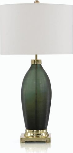 a green table lamp with a white shade on the base and a gold plated base