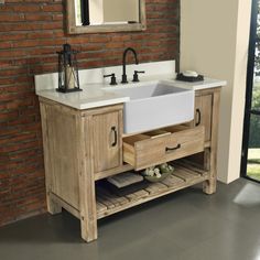 a bathroom sink sitting under a mirror next to a wooden shelf with drawers underneath it