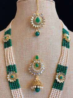 Kundan mala with matching jhumki and Tikka . Glass beads mala 5 layer work. Pendant is about 4 inch wide and long. Green Kundan Beads For Gift, Green Necklaces With Latkans For Puja, Green Temple Jewelry Mala For Festive Occasions, Traditional Green Beads For Festive Occasions, Green Tilla Necklaces With Round Beads, Traditional Green Beads For Festive Season, Green Temple Jewelry Bridal Necklace With Latkans, Green Temple Jewelry Beads For Wedding, Green Spiritual Jewelry For Diwali