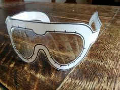 a pair of goggles sitting on top of a wooden table