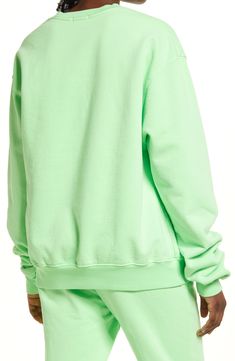 Extra-long sleeves and a drapey oversized fit elevates the lofty vibe of a cotton pullover that's lined with soft and snuggly fleece. 26" length (size 2) Crewneck Long sleeves Ribbed cuffs and hem 100% cotton Machine wash, tumble dry Imported Women's Clothing Black Owned and Founded Green Hoodie Sweatshirt For Loungewear, Oversized Green Long Sleeve Sweater, Green Long Sleeve Sweatshirt For Spring, Spring Fleece Tops With Cozy Fit, Cozy Fit Fleece Tops For Spring, Cozy Cotton Sweats For Spring, Spring Cozy Hoodie With Crew Neck, Trendy Crew Sweats For Spring, Spring Drop Shoulder Hoodie For Loungewear